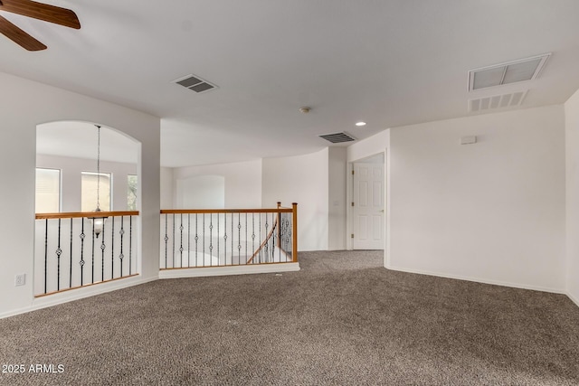 carpeted spare room featuring visible vents, recessed lighting, and ceiling fan