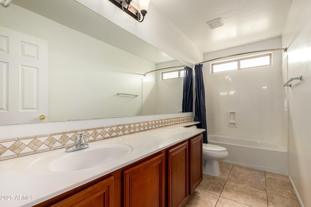 bathroom with vanity, toilet, shower / bath combination with curtain, backsplash, and visible vents