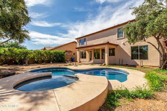 view of pool featuring a patio area and a pool with connected hot tub