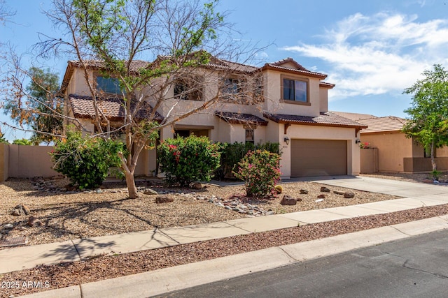 view of front facade featuring fence, stucco siding, an attached garage, driveway, and a tile roof