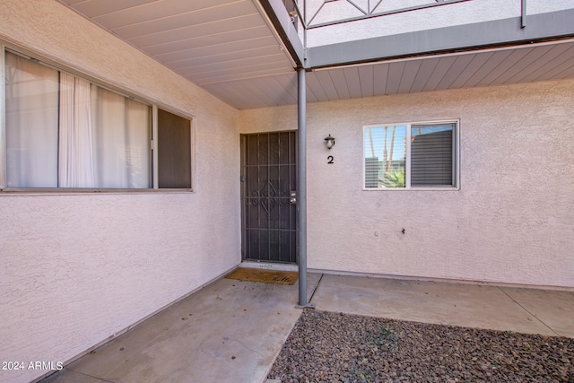 entrance to property with a patio area