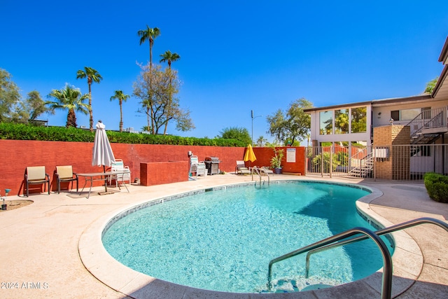 view of pool featuring a patio