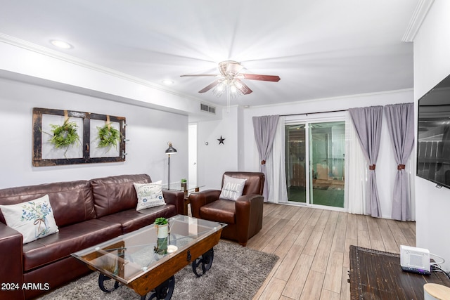 living room with ceiling fan, crown molding, and light hardwood / wood-style flooring