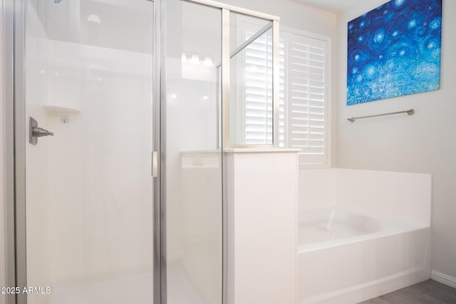 bathroom with independent shower and bath