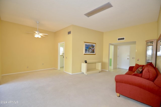 living room with a ceiling fan, light colored carpet, visible vents, and baseboards