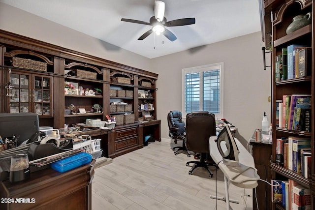 office featuring light wood-style floors and a ceiling fan