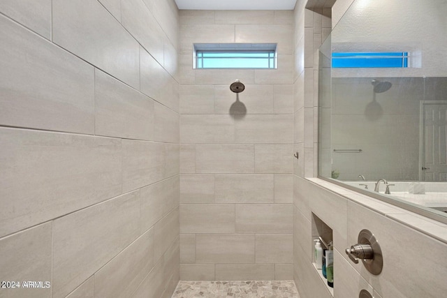 full bath featuring a tile shower