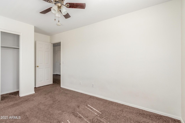 unfurnished bedroom with a closet, carpet flooring, ceiling fan, and baseboards