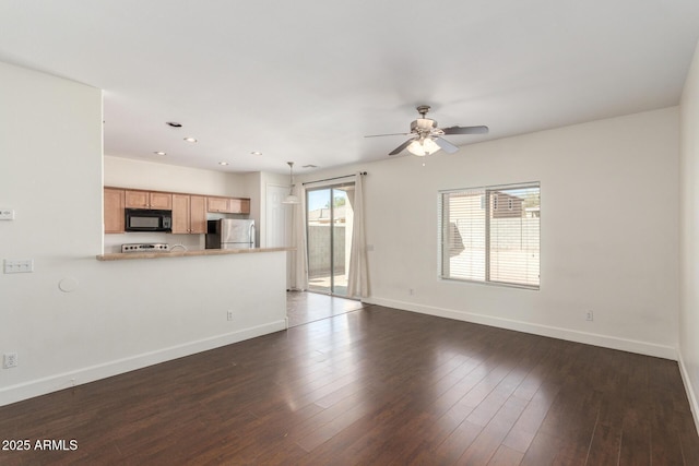 unfurnished living room with dark wood-style floors, recessed lighting, ceiling fan, and baseboards