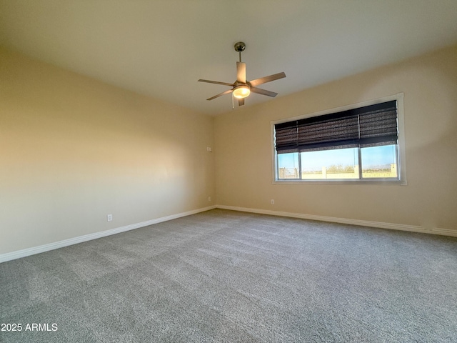 spare room featuring carpet flooring and ceiling fan