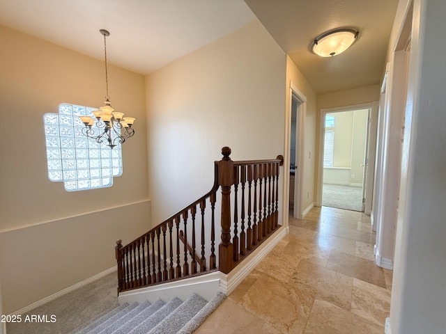 hallway featuring a chandelier