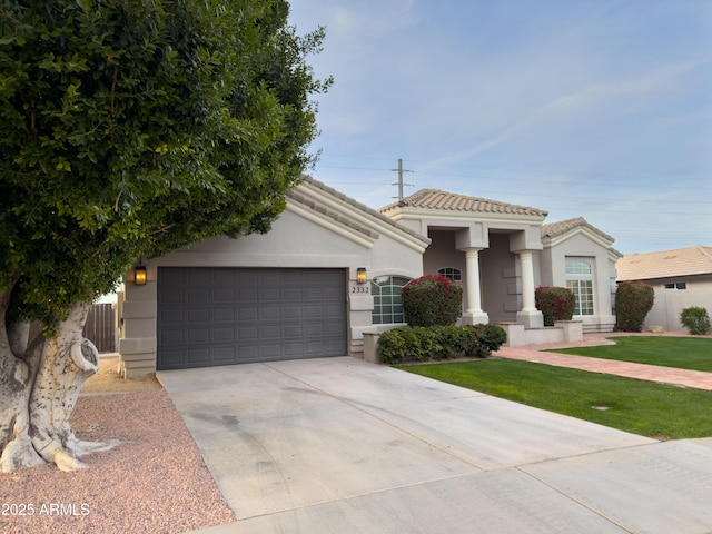 view of front of home with a garage and a front yard