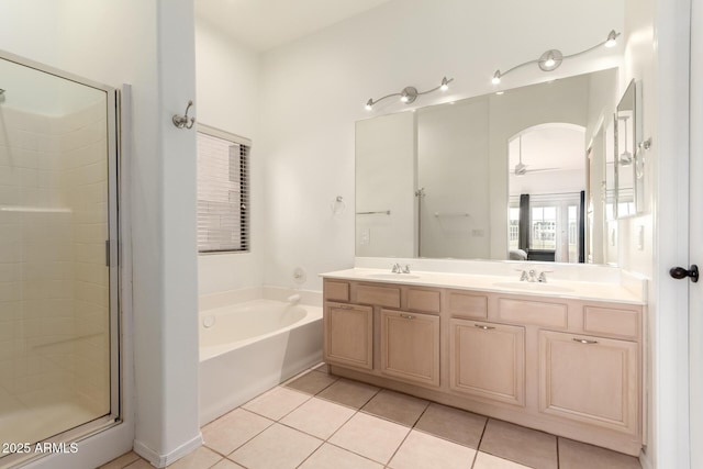 1022 S Butte Ln, Gilbert, AZ 85296 - full bathroom featuring double vanity, a garden tub, tile patterned floors, a shower stall, and ensuite bathroom