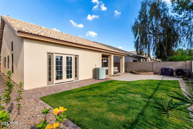 1022 S Butte Ln, Gilbert, AZ 85296 - rear view of house with stucco siding, a patio, a fenced backyard, french doors, and a tiled roof