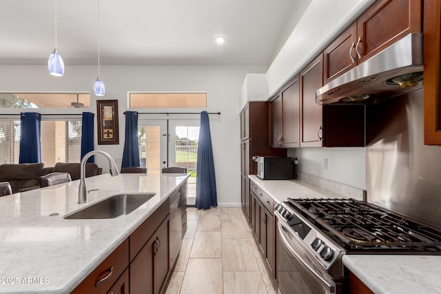 1022 S Butte Ln, Gilbert, AZ 85296 - kitchen featuring appliances with stainless steel finishes, under cabinet range hood, light marble finish floors, hanging light fixtures, and light stone countertops
