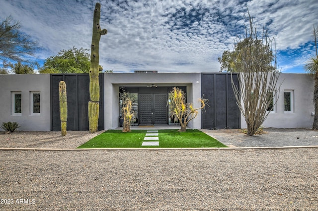 back of property with stucco siding