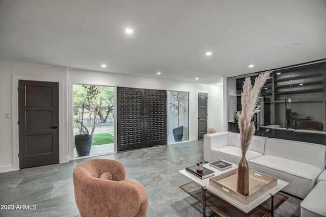 living room featuring mail area and recessed lighting