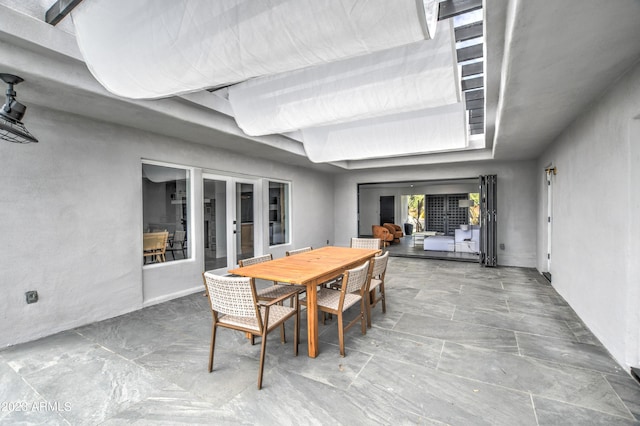 view of patio featuring outdoor dining area