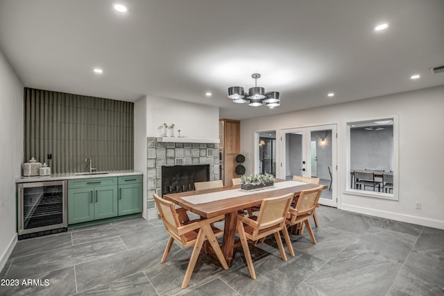 dining space featuring french doors, recessed lighting, visible vents, beverage cooler, and baseboards