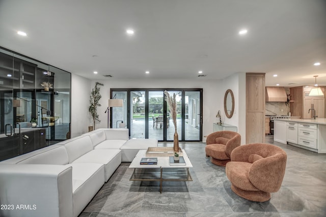 living area with visible vents and recessed lighting