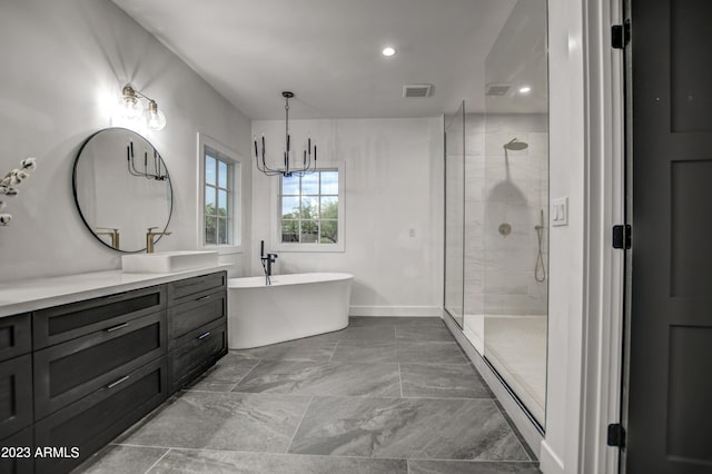 bathroom with visible vents, a freestanding bath, vanity, and a shower stall