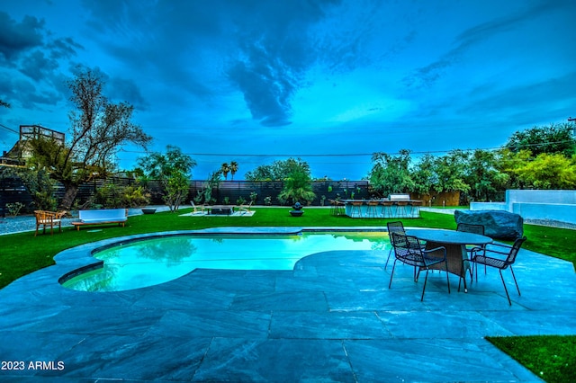 view of swimming pool featuring a fenced in pool, a patio, a fenced backyard, outdoor dining area, and a yard