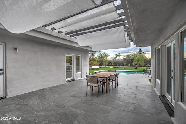 view of patio / terrace featuring a fenced in pool, outdoor dining area, and fence