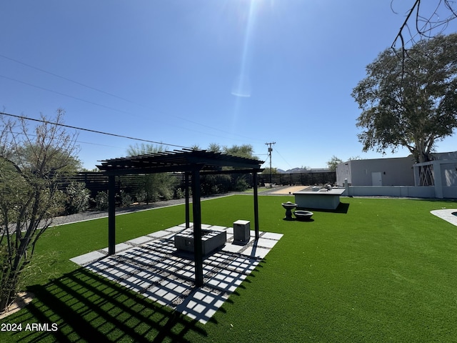 view of yard featuring a fire pit, a patio area, fence, and a pergola