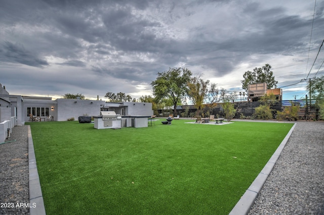 view of yard with a fire pit, a patio, and fence private yard