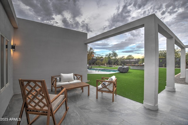 view of patio featuring fence and a fenced in pool