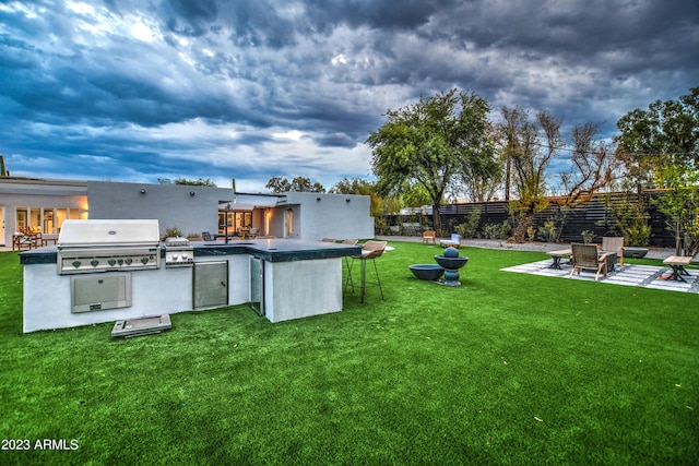 view of yard with a patio, area for grilling, and fence