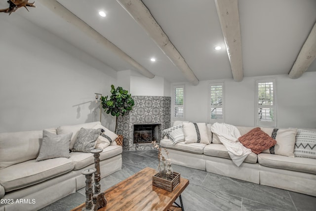 living room featuring recessed lighting, beam ceiling, and a high end fireplace