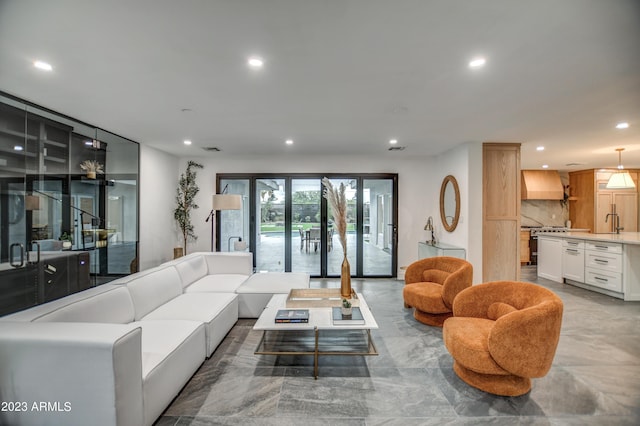 living area featuring visible vents and recessed lighting