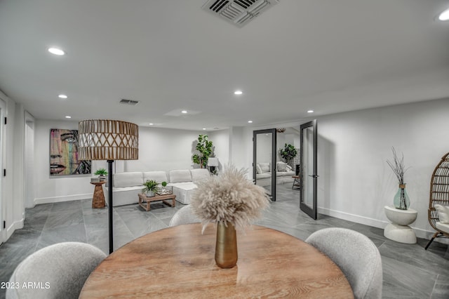 dining room with baseboards, visible vents, and recessed lighting