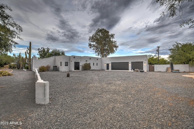 southwest-style home with fence and stucco siding