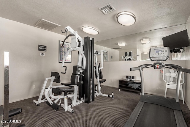 1402 E Guadalupe Rd Unit 234, Tempe, AZ 85283 - exercise room with baseboards and a textured ceiling