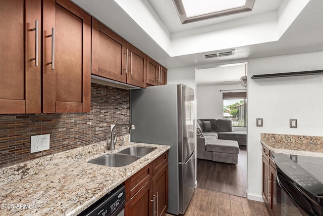 1402 E Guadalupe Rd Unit 234, Tempe, AZ 85283 - kitchen featuring a sink, black electric range oven, wood finished floors, backsplash, and light stone countertops