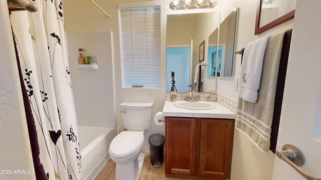 full bathroom with vanity, tile patterned flooring, toilet, and shower / bathtub combination with curtain