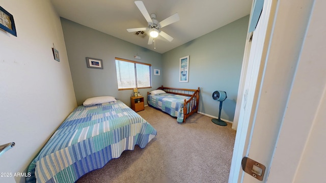 carpeted bedroom featuring vaulted ceiling and ceiling fan