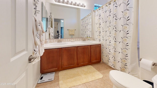 bathroom featuring a shower with curtain, vanity, and toilet