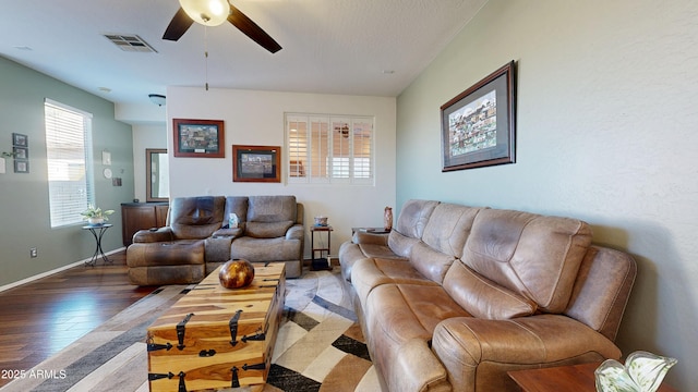 living room with hardwood / wood-style flooring and ceiling fan