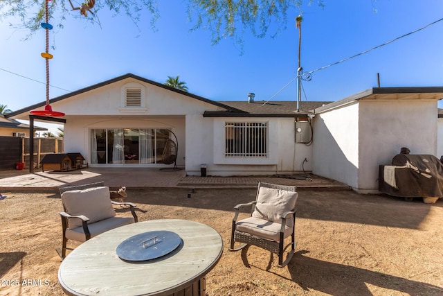 rear view of house featuring a patio