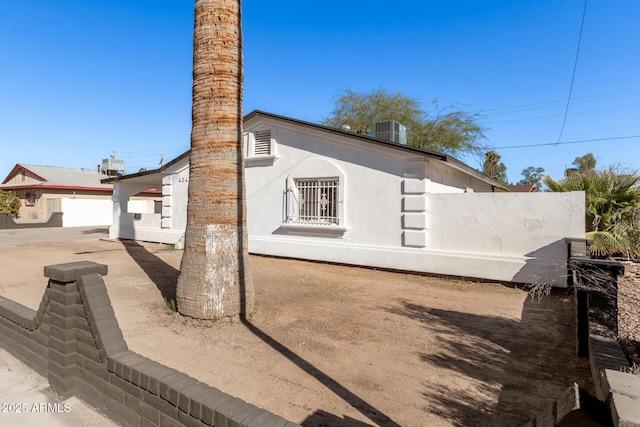 view of side of property featuring cooling unit