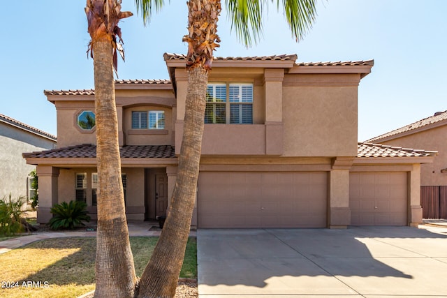 mediterranean / spanish-style house featuring a garage