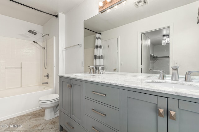 full bathroom with vanity, shower / bath combo with shower curtain, toilet, and tile patterned floors