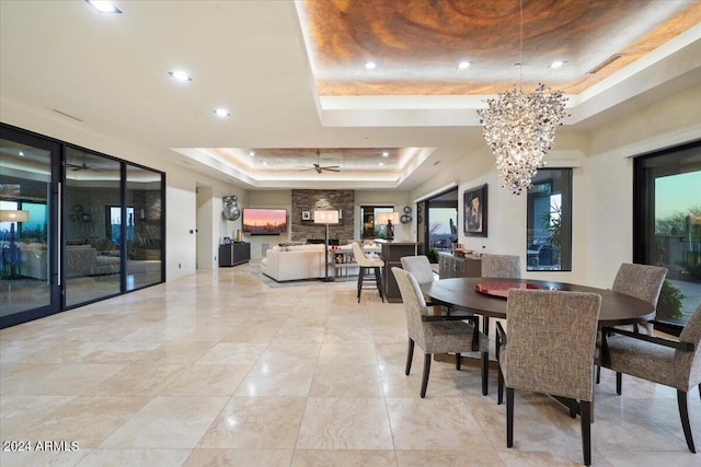 39254 N 104th Pl, Scottsdale, AZ 85262 - dining area with a raised ceiling, ceiling fan with notable chandelier, visible vents, and recessed lighting