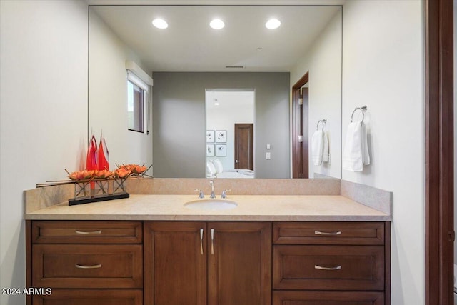 39254 N 104th Pl, Scottsdale, AZ 85262 - ensuite bathroom featuring recessed lighting, vanity, visible vents, and connected bathroom