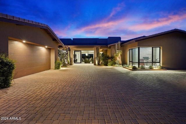 39254 N 104th Pl, Scottsdale, AZ 85262 - view of front of home with a garage, decorative driveway, and stucco siding