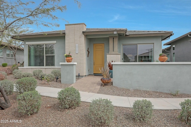 prairie-style house with stucco siding