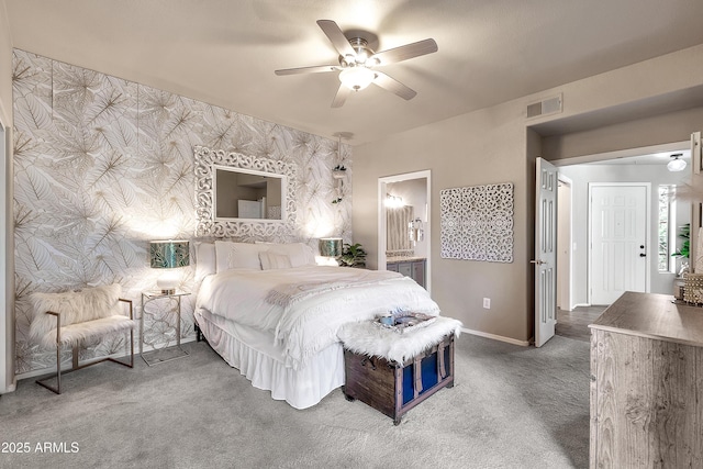 bedroom featuring ceiling fan, visible vents, baseboards, carpet, and wallpapered walls